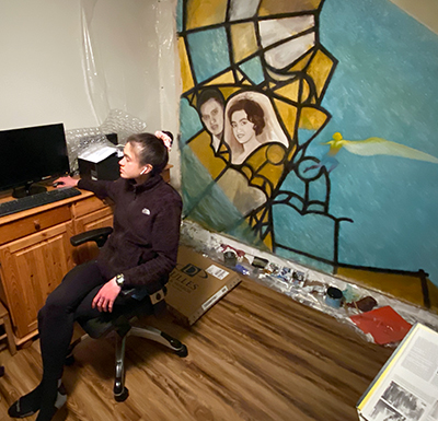 "Michaela in her basement which doubles as a virtual reality workspace and art studio "