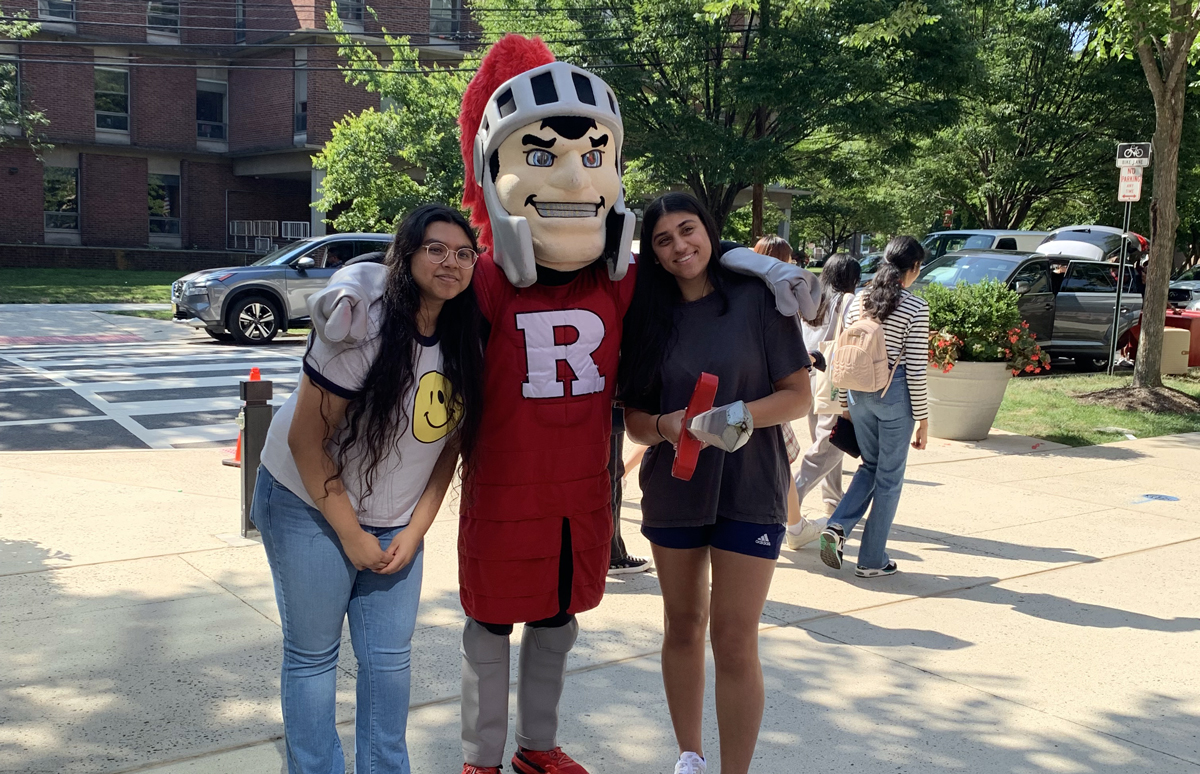 Photo showing two Honors College students/friends with a Scarlet Knight
