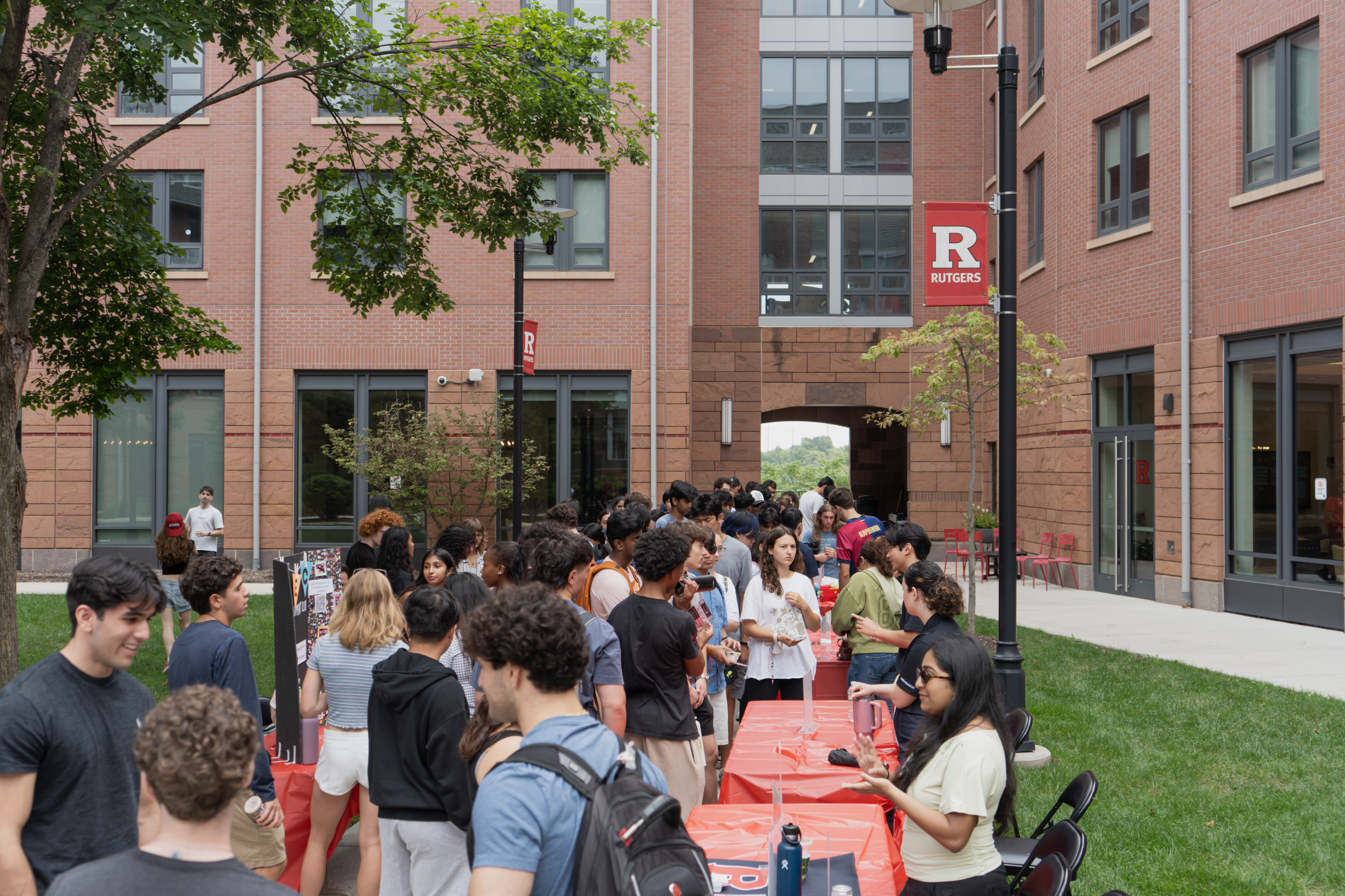 In picture, Honors College Students line up outside the Rodkin Family Courtyard to participate in the HC Involvement Fair