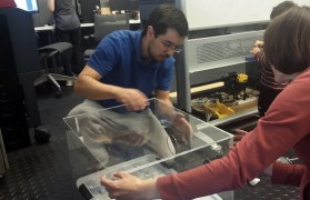 Aaron assembling the intubation boxes with Jonina, his wife, and his family