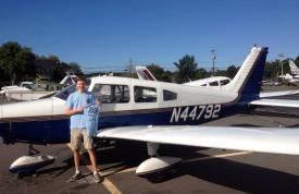 Bobby Randolph in front of a plane