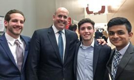 Honors College sophomores, pictured with Mr. Schwartz (L-R), Johnny Shamir, Anthony Stella, and Amol Lotia, were excited and inspired by his story.