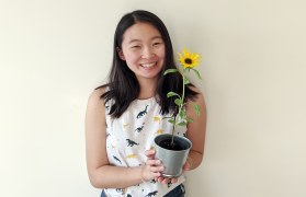 Jacqueline Sun with potted sunflower