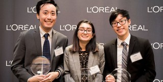 Alex, Zaynab, and Justin with their trophies.