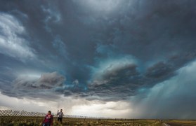 Photo showing meteorologists working in the field