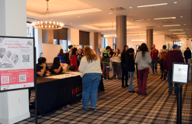 Student Presenters and Guests Gathering at the Honors College Academic Showcase Event