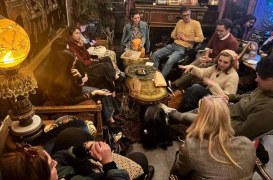 Photo showing students sitting in a circle and talking